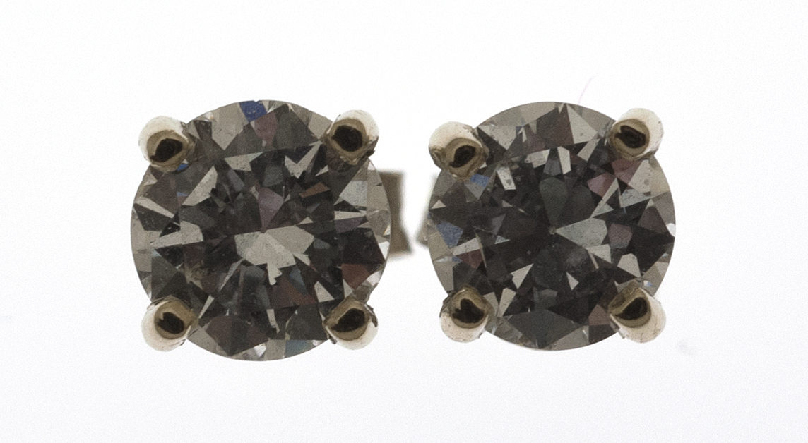 Appraisal: PAIR OF KT WHITE GOLD AND DIAMOND STUD EARRINGS Diameters