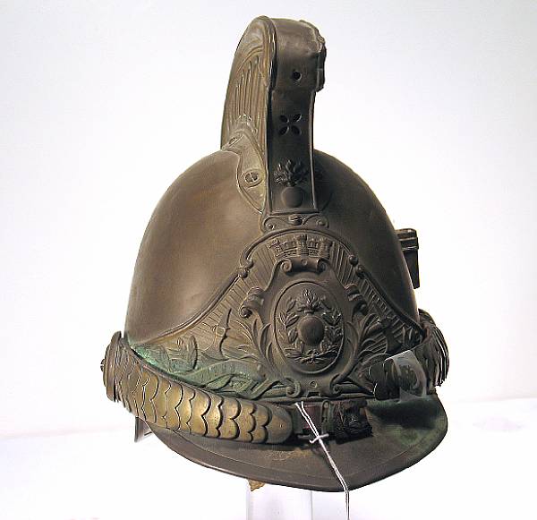 Appraisal: A continental pompier's helmet th century The brass skull with