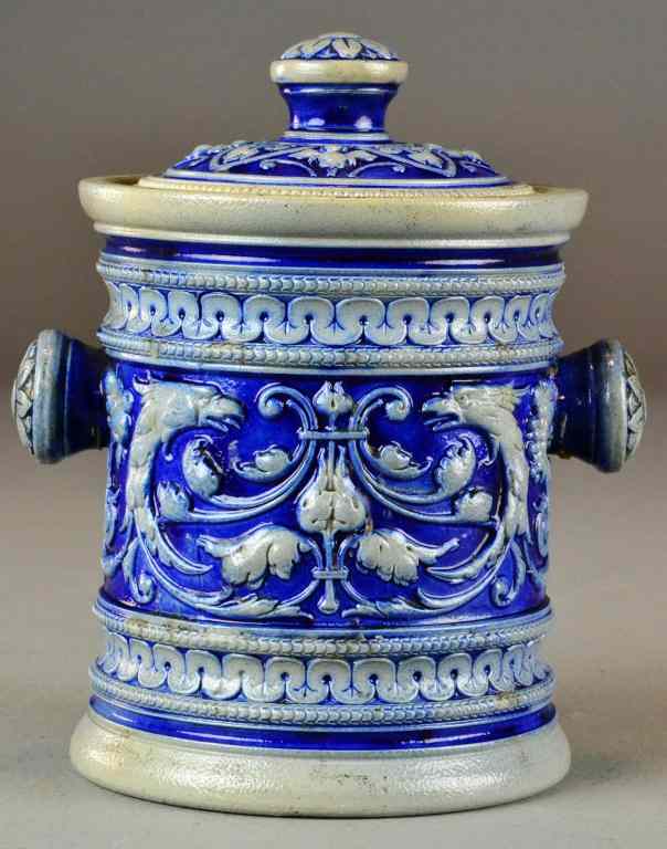 Appraisal: A German Cobalt Decorated Jar And CoverWith raised relief decoration