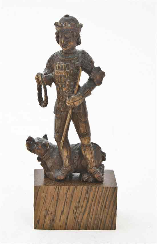 Appraisal: A Continental Carved Wood Figure depicting an armored knight with