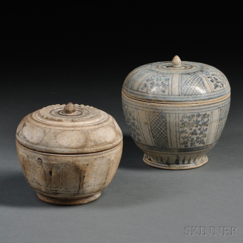 Appraisal: Two Si Satchanalai-style Stoneware Covered Jars Thailand a blue and