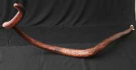 Appraisal: John Mongda Snake poker-worked wood carved signature on belly together