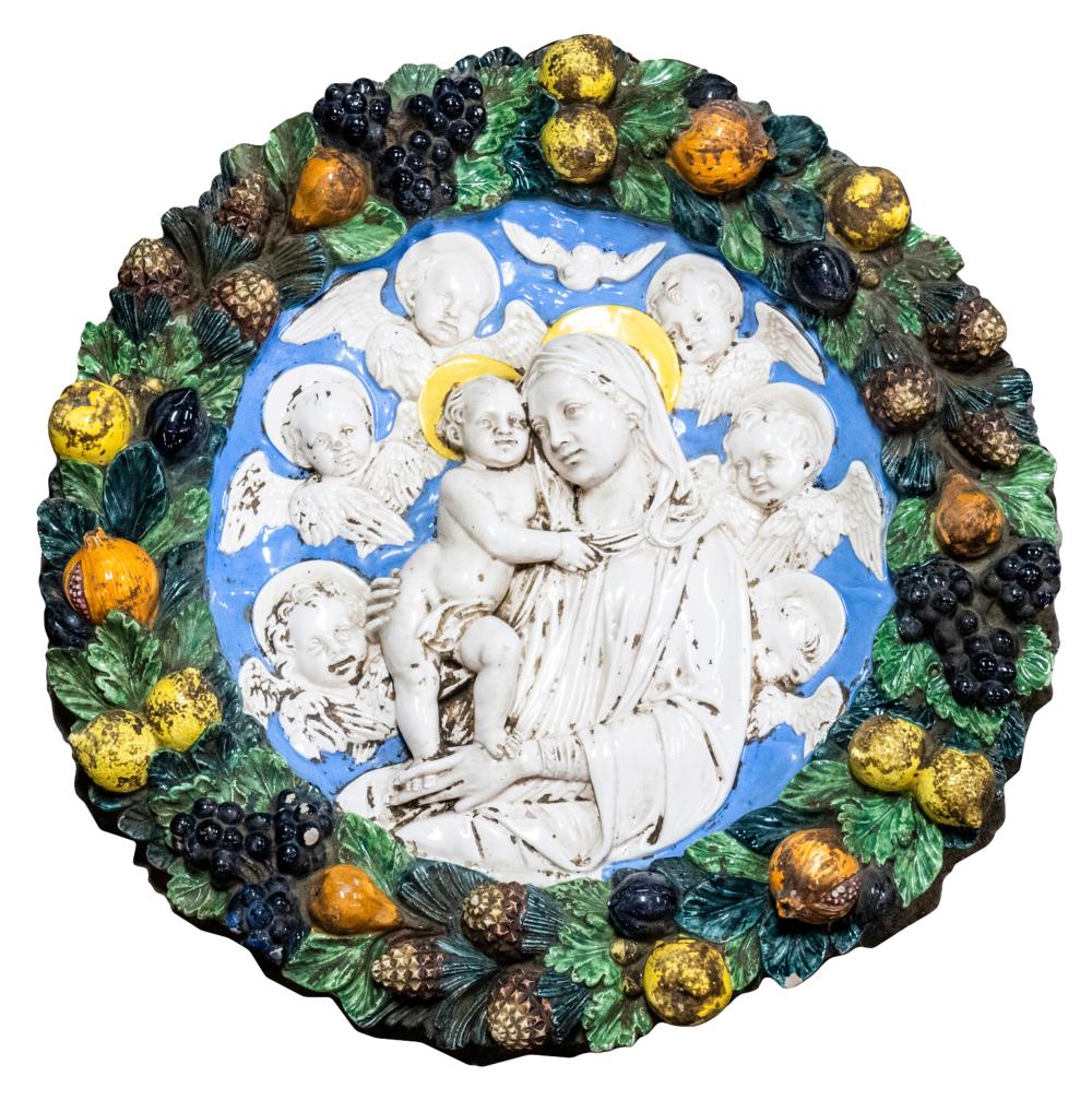 Appraisal: DELLA ROBBIA-STYLE MAJOLICA RELIEF WALL PLAQUEdepicting the Virgin and Child