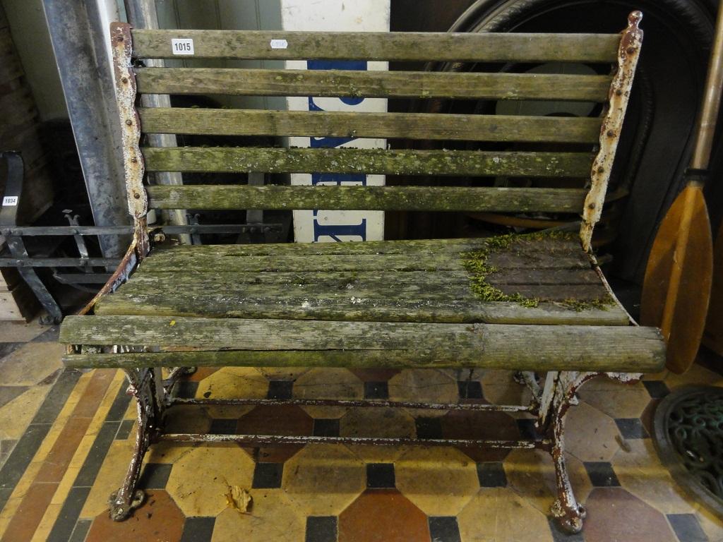 Appraisal: A small Victorian garden bench with weathered timber slatted seat