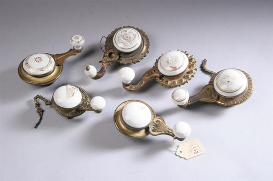 Appraisal: SIX VICTORIAN GILE-METAL AND PORCELAIN BELL PULLS late th century