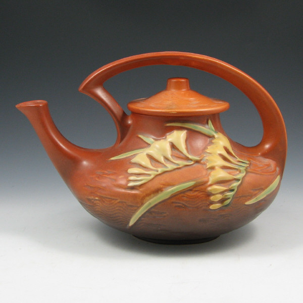 Appraisal: Roseville Freesia T Teapot Roseville Freesia teapot in brown Marked