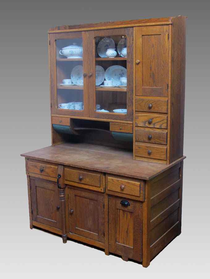 Appraisal: VICTORIAN OAK PASTRY CUPBOARD Multi compartment two piece Hoosier type