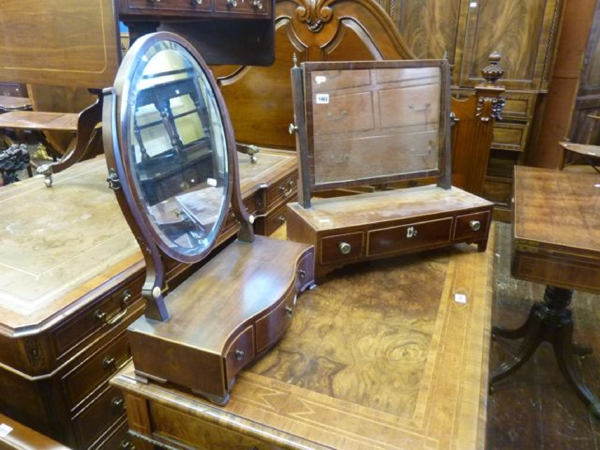 Appraisal: A Georgian mahogany toilet mirror the platform base fitted with