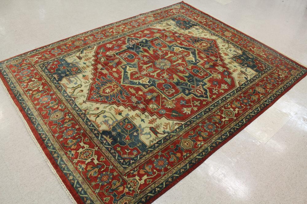 Appraisal: HAND KNOTTED ORIENTAL CARPET Persian Serapi or Heriz design centering