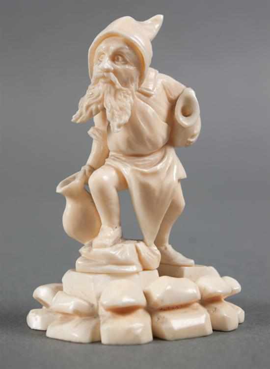 Appraisal: Continental carved ivory gnome figure late th century modeled as