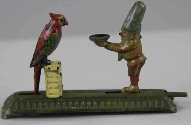 Appraisal: MEIER GNOME FEEDING PARROT PENNY TOY Germany lithographed tin depicts