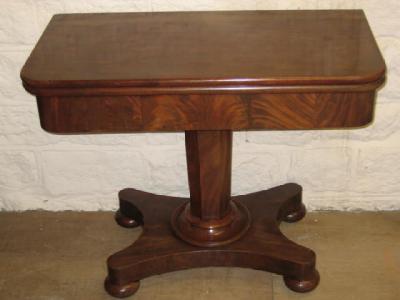 Appraisal: A VICTORIAN MAHOGANY FOLDING TEA TABLE of rounded oblong form