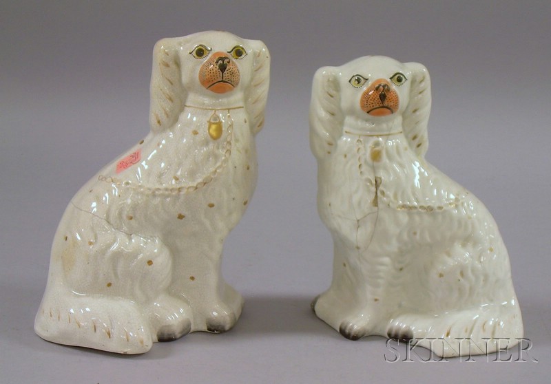 Appraisal: Two Staffordshire Seated Spaniels ht and in