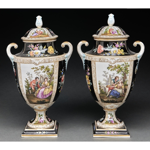 Appraisal: A pair of German porcelain shield shaped vases and covers