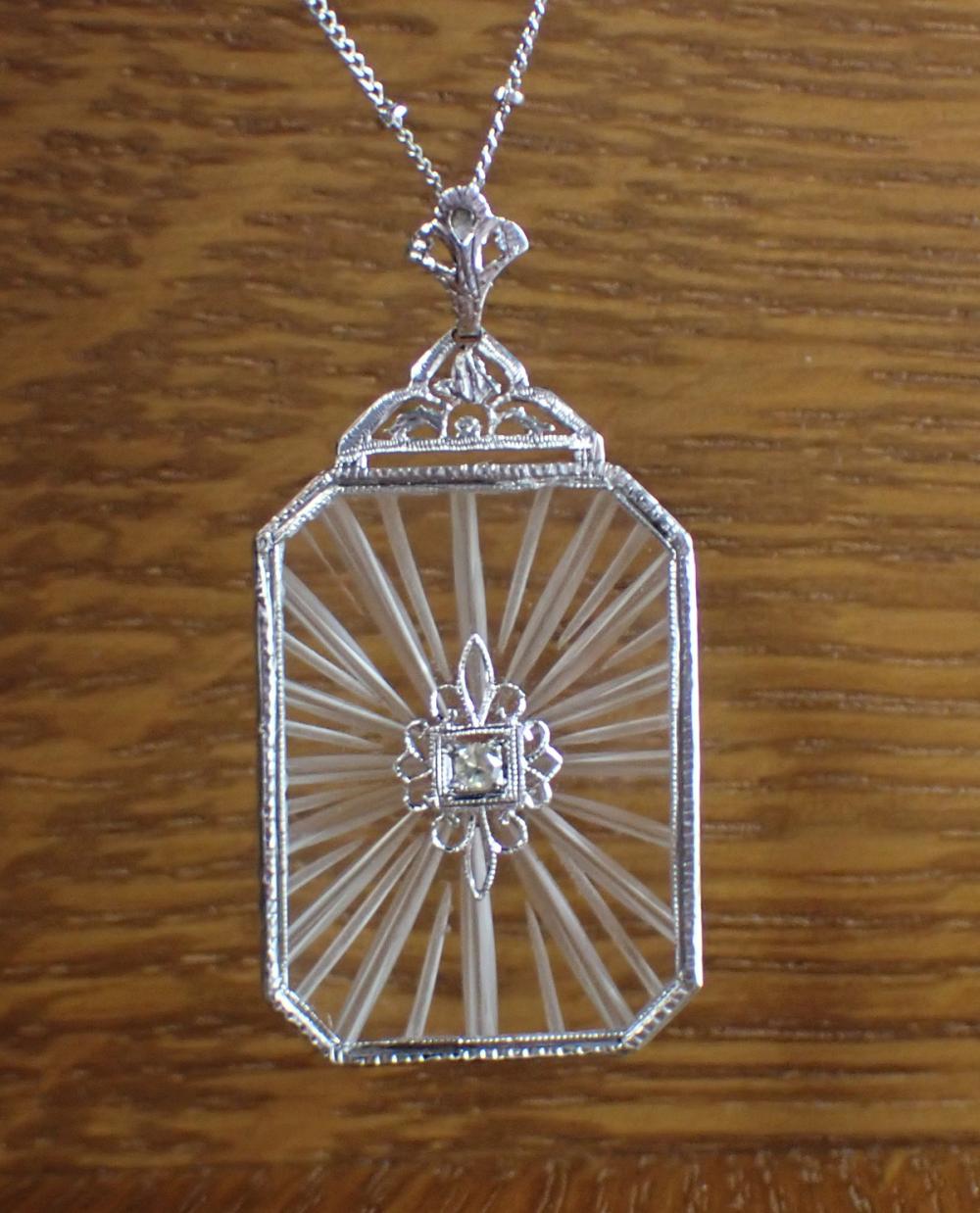 Appraisal: VINTAGE DIAMOND AND CAMPHOR GLASS PENDANT NECKLACE with a k