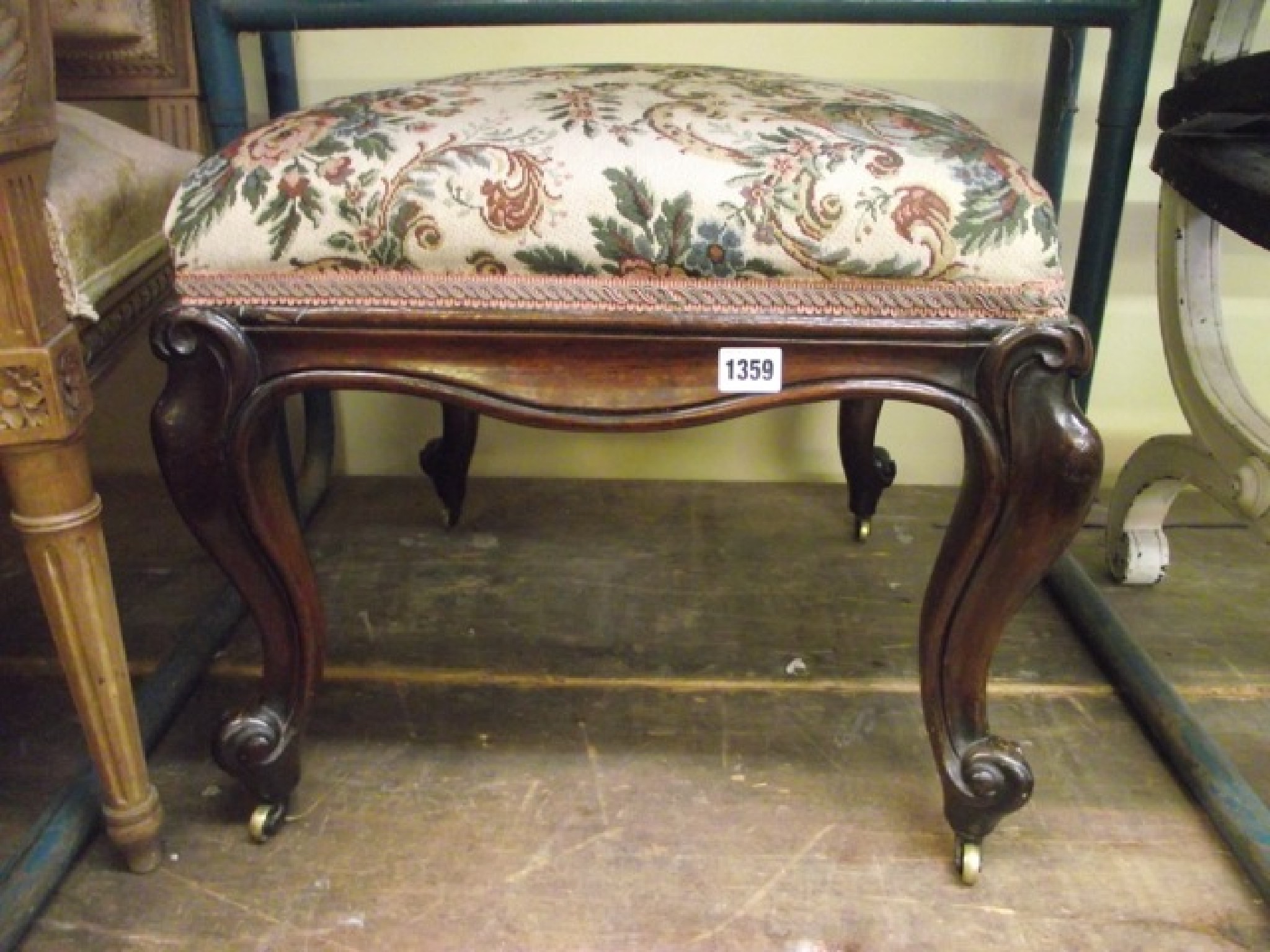 Appraisal: A mid th century mahogany centre stool raised on cabriole