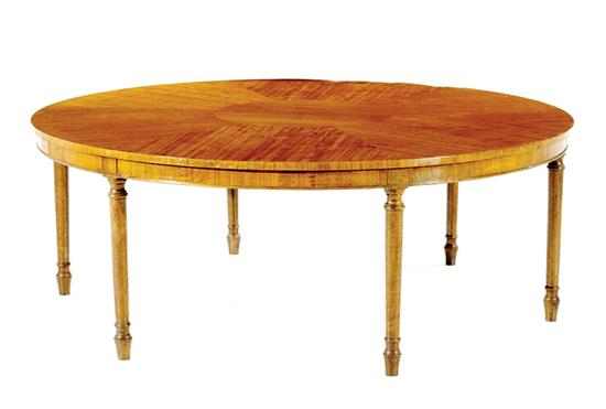 Appraisal: Edwardian style circular satinwood coffeetable segmented top with central medallion