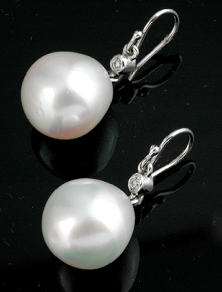 Appraisal: A PAIR OF SOUTH SEA PEARL AND DIAMOND DROP EARRINGS