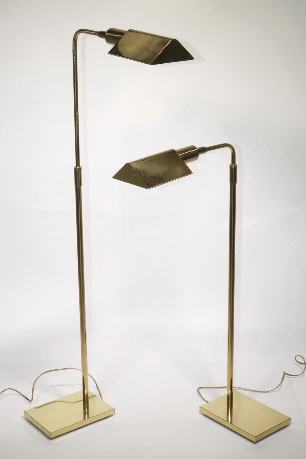 Appraisal: PR OF BRASS FLOOR LAMPS Matching brass adjustable floor lamps