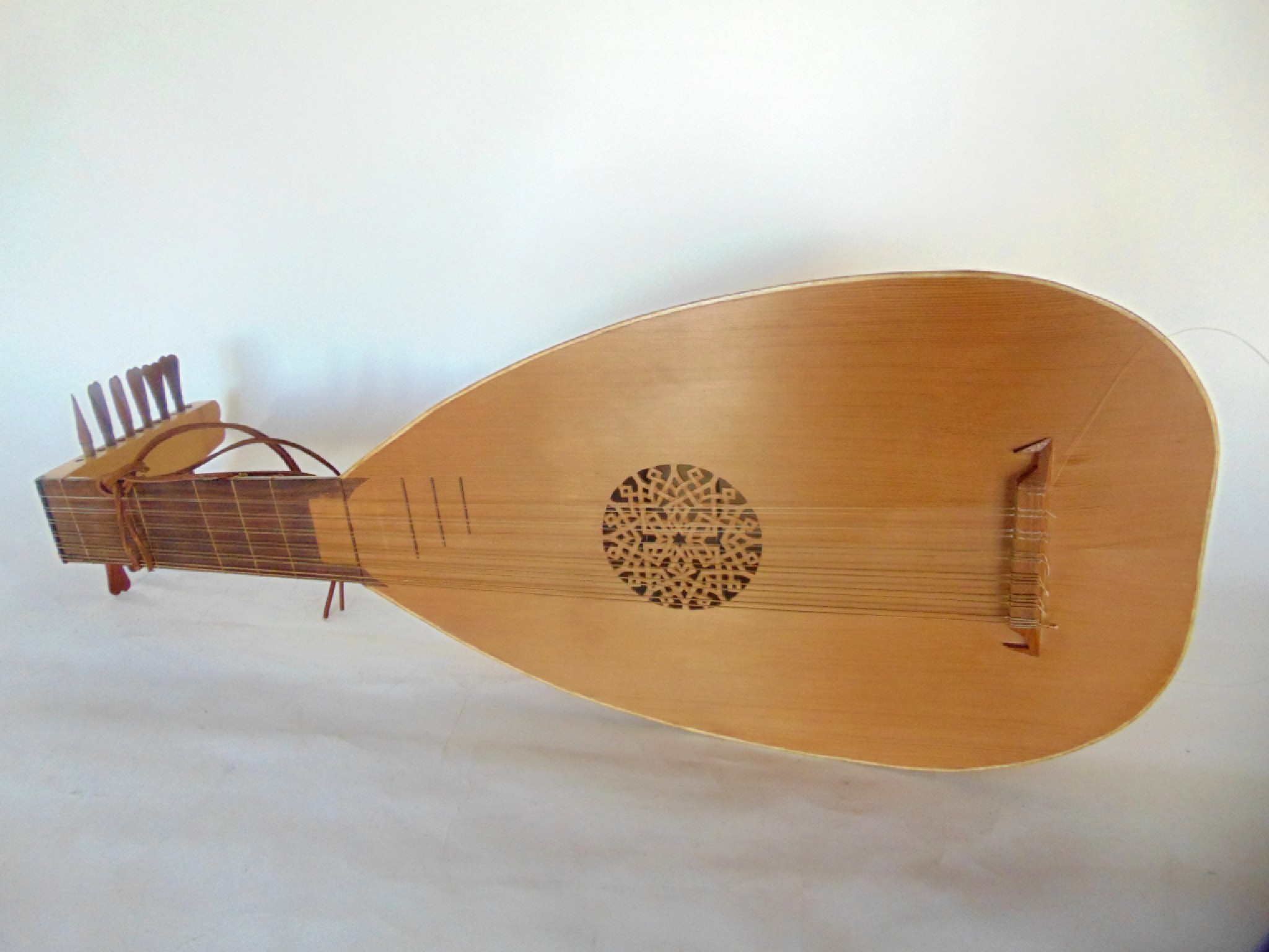 Appraisal: A string timber lute with pierced sound hole and timber