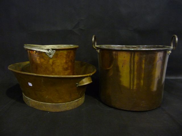 Appraisal: Two large th century copper pans and a copper pale