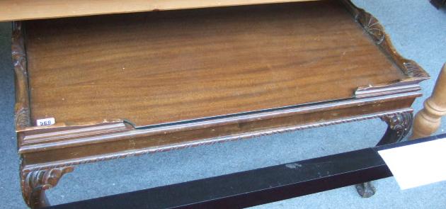 Appraisal: A th century mahogany rectangular coffee table with inset top