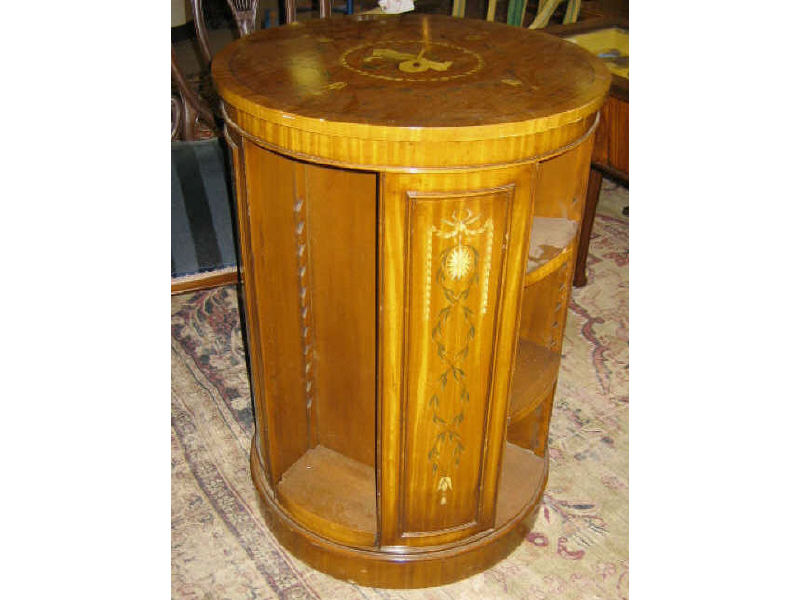 Appraisal: ENGLISH EDWARDIAN MAHOGANY CIRCULAR BOOKCASE Crossbanded top centering a musical