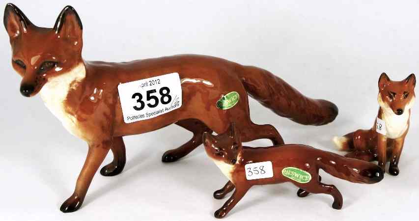 Appraisal: Beswick large walking fox and small fox tiny chip to