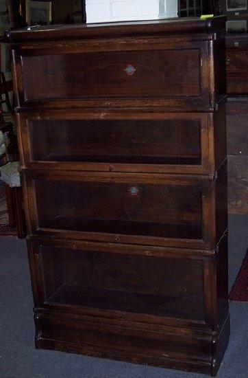 Appraisal: A Globe Wernicke four-section bookcase each section enclosed by a