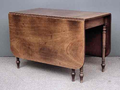 Appraisal: A George III mahogany dropleaf cottage dining table the top