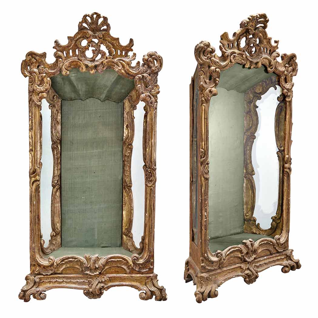 Appraisal: Pair of Italian Rococo Giltwood Vitrines Each hinged glazed door