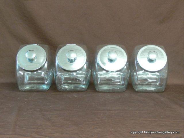 Appraisal: FOUR Glass Counter Top Canisters with Lids Resemble old time