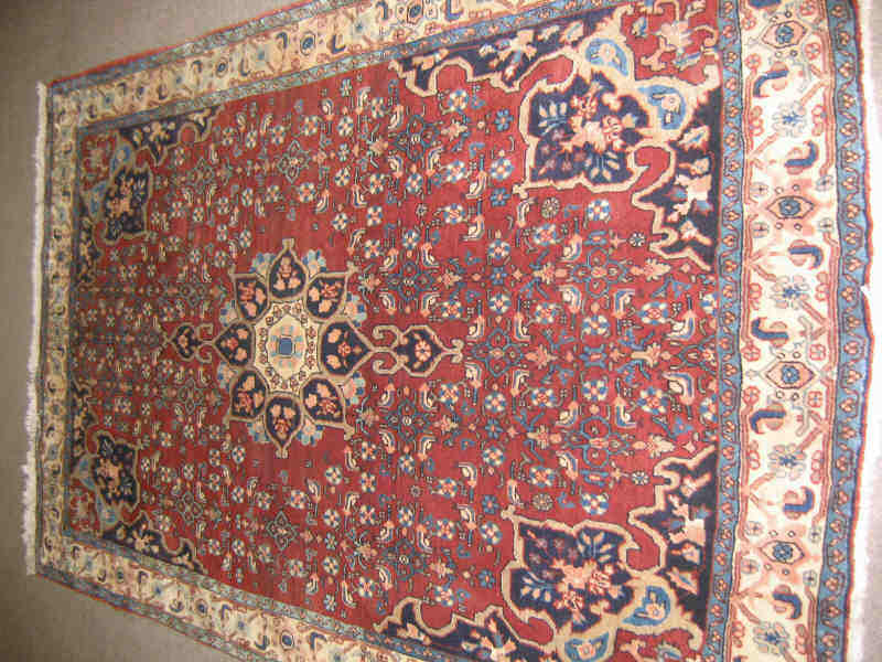 Appraisal: BIJAR THROW RUG The red herati field centers an indigo