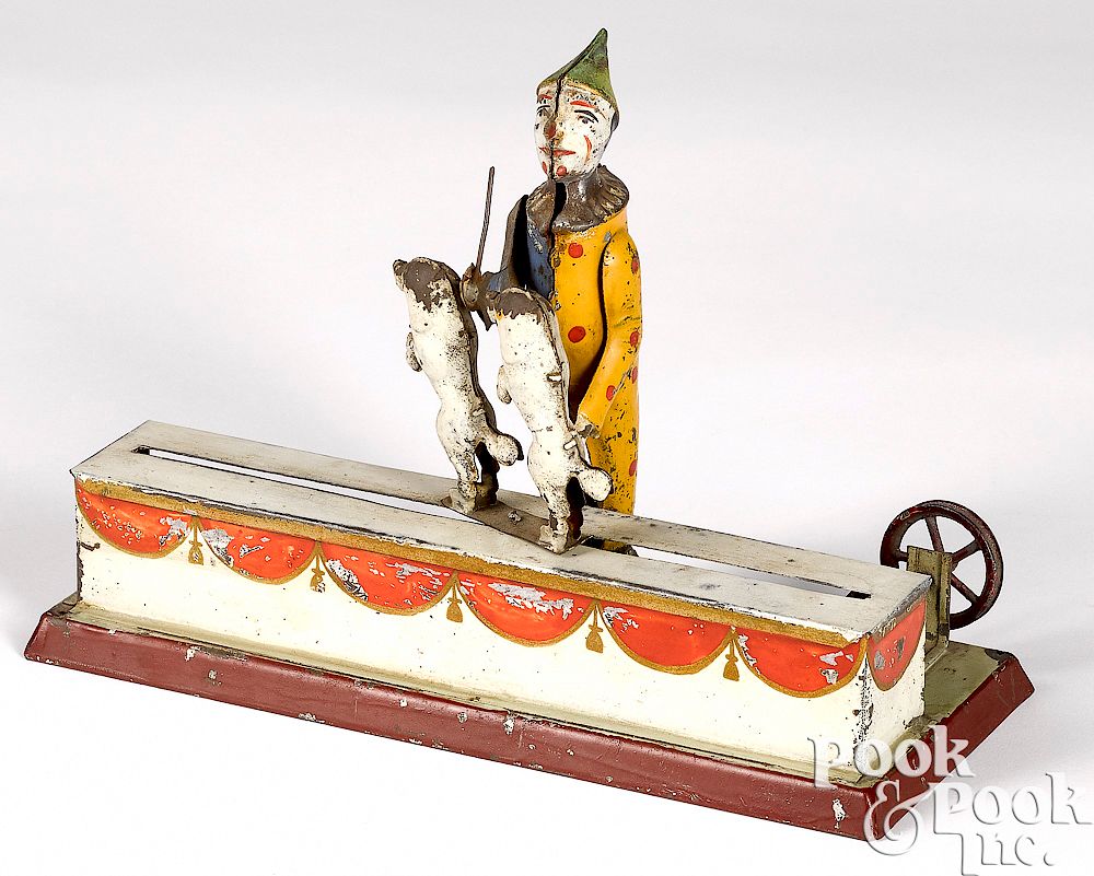 Appraisal: Clown with prancing dogs steam toy accessory Painted tin clown