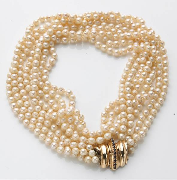 Appraisal: A semi-baroque cultured pearl sapphire and k gold four strand