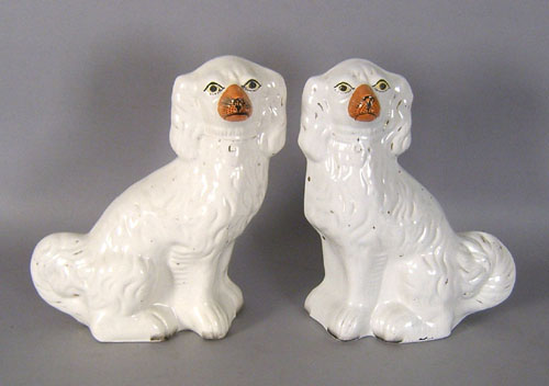 Appraisal: Pair of Staffordshire spaniels together with a single example