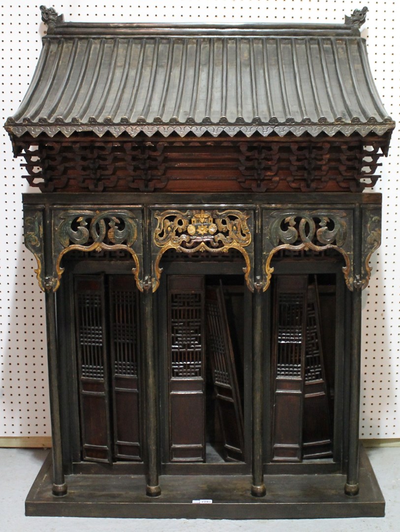 Appraisal: A th century Chinese hardwood shrine cabinet in the form