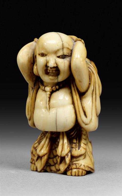 Appraisal: NETSUKE OF A MONK Japan th century H cm Ivory