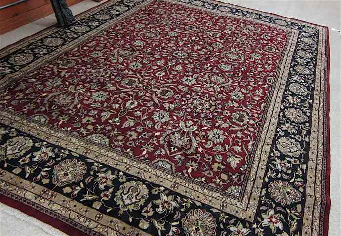 Appraisal: HAND KNOTTED ORIENTAL CARPET Indo-Persian overall floral design on red