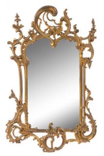 Appraisal: A Rococo Style Giltwood Mirror Height x width inches A