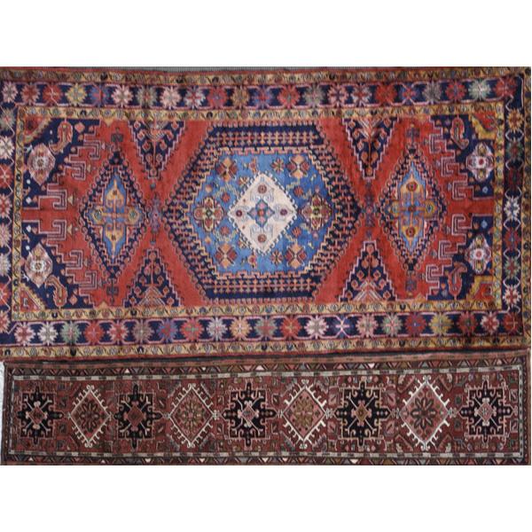 Appraisal: PERSIAN Two rugs c Vis small rug with geometric polychrome