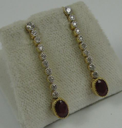 Appraisal: PAIR OF RUBY DIAMOND AND K GOLD EARRINGS each set