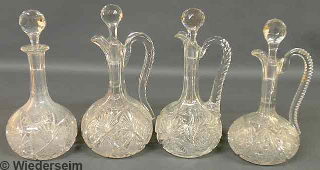 Appraisal: Three cut glass wine ewers and a decanter Tallest h