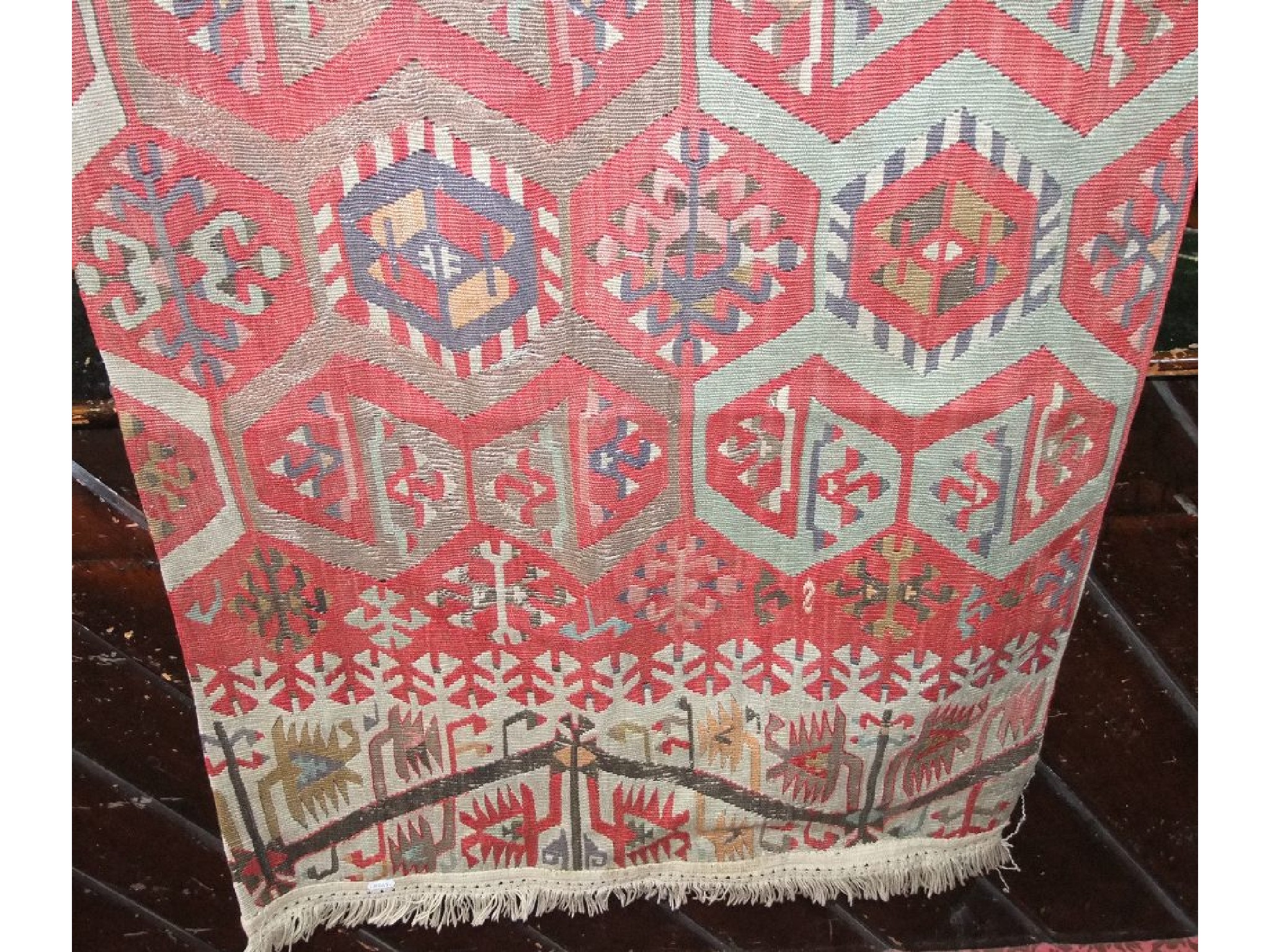 Appraisal: A Kelim flat weave rug in a red beige and