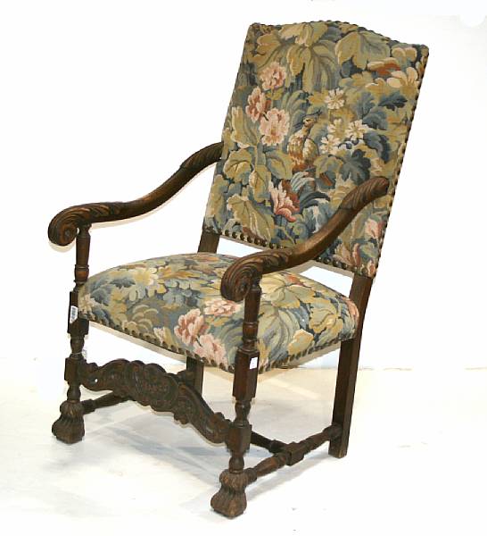 Appraisal: A pair of Flemish Baroque style walnut upholstered armchairs late