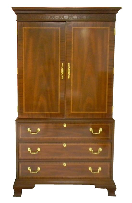 Appraisal: Councill Craftsmen Georgian style single piece armoire mahogany projecting cornice