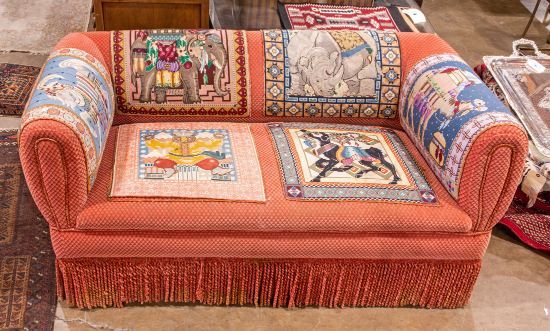 Appraisal: RED UPHOLSTERED SOFA Red upholstered sofa decorated with carousel animals