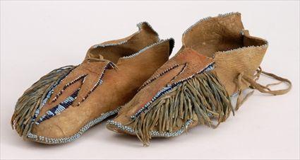 Appraisal: PAIR OF SOUTHERN PLAINS MOCCASINS in See Pleasing The Spirits