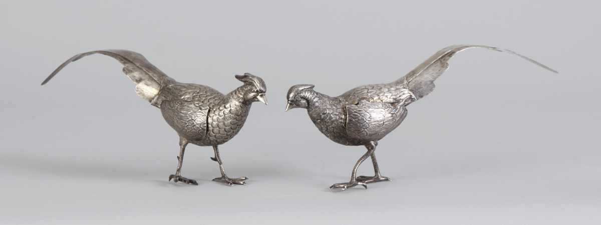 Appraisal: Pair of Sterling Silver Table Pheasants Troy oz foot reattached