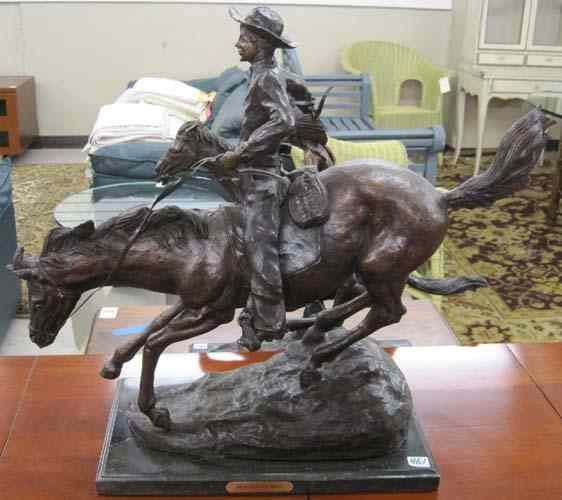 Appraisal: TWO WESTERN BRONZE SCULPTURES cowboy on horseback and Indian chief